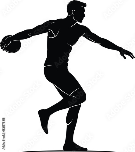 Silhouette of a discus thrower in action