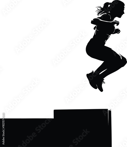 Silhouette of a woman jumping onto a platform box
