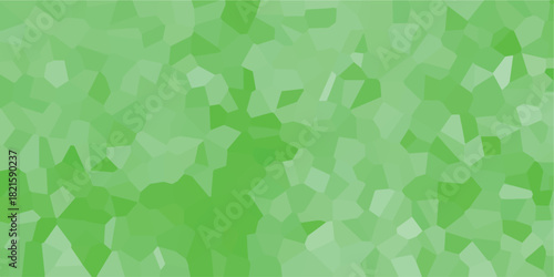 Geometric abstract background with a mosaic of irregular green polygons in varying shades creating a modern and organic textured pattern for design