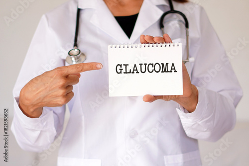 glaucoma. medical concepts. female doctor pointing to the word in her medical notebook