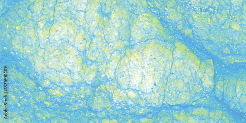 Textured abstract background in shades of blue and yellow, with a speckled appearance and subtle cracked surface, suggesting a natural stone or weathered material for artistic backgrounds