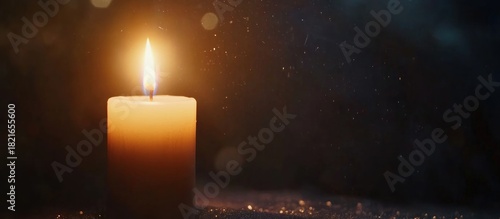 Illuminating hope, A single candle shines brightly in the darkness