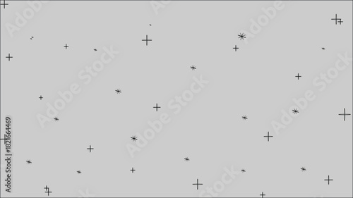 A grayscale image featuring scattered dark marks against a light background