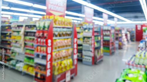 Wallpaper Mural Blurred background of interior of supermarket store aisle with various products on shelves and a prominent "Super Promo!" sign. abstract blur of convenience store aisle, fast moving consumer goods. Torontodigital.ca