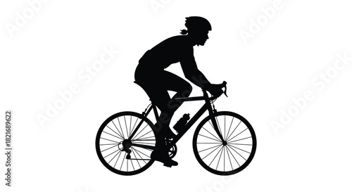 A cyclist in motion captured as a striking black silhouette
