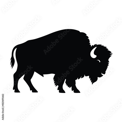 Black silhouette of a powerful american bison standing profile