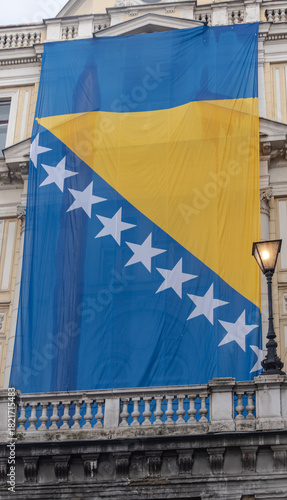 Bosnian flag around  Eternal flame for  Statehood Day
