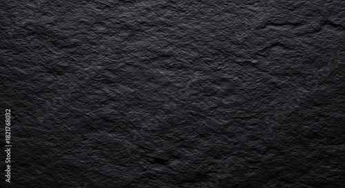 Close up textured dark grey rough stone surface background