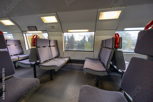 Train interior with empty seats and windows