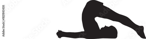 Silhouette of a person performing a yoga plow pose exercise