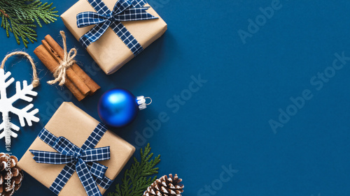 Festive christmas gifts and decorations on a deep blue background
