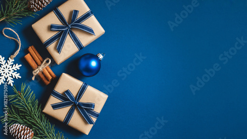 Festive christmas gifts and decorations on a deep blue background