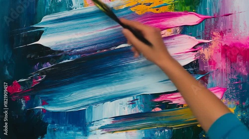 Abstract art creation brushstrokes of vivid colors on canvas surface