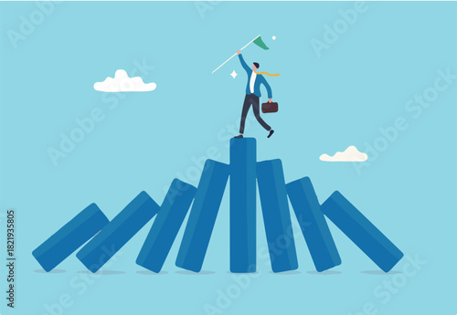 Winner take all, survive business competition or strength to overcome difficulty, economic crisis or recession, business winner concept, success businessman on stand strong bar graph domino collapse. 