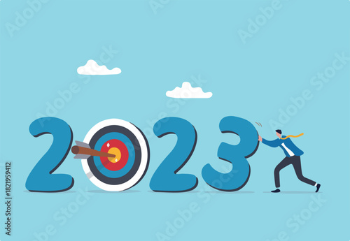 Year 2023 business target, new year resolution or challenge to achieve goal, aim for business success, growth or motivation to succeed concept, businessman changing year to 2023 target