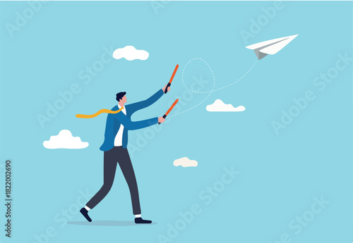 Business strategy or leadership to control working project to success and achieve target concept, smart confident businessman leader using air traffic control light to launch origami paper airplane.