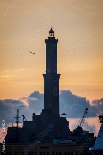 The old Porto Antico of Genoa at the sunset viewing the Lantern of Genoa, symbol of the town of Cristoforo Colombo.