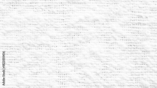 Background from white coarse canvas texture. Textured white knit fabric showcases intricate weaving patterns and soft fibers suitable for cozy apparel and home textiles.