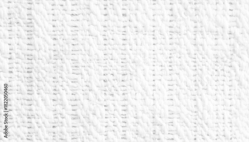 Background from white coarse canvas texture. Textured white knit fabric showcases intricate weaving patterns and soft fibers suitable for cozy apparel and home textiles.