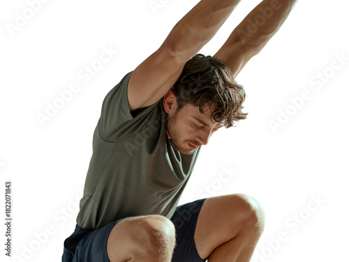 Young man stretching on white background, focusing on fitness