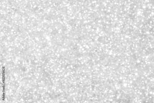 Glittering silver background with sparkling lights for festive, elegant and luxurious visuals