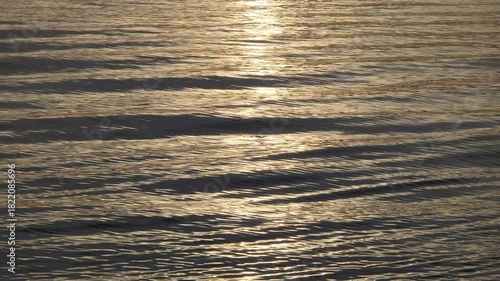 abstract golden sunset reflection on water wave pattern background footage