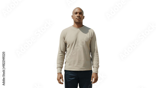 An adult male model stands confidently in front of a neutral backdrop, wearing a casual shirt and jeans.