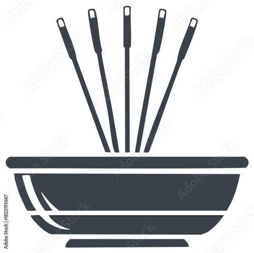 Bowl with multiple cooking skewers inserted