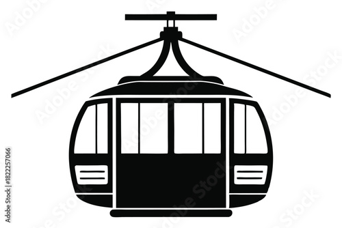 A black silhouette cable car ascends with thick cables in a striking presence