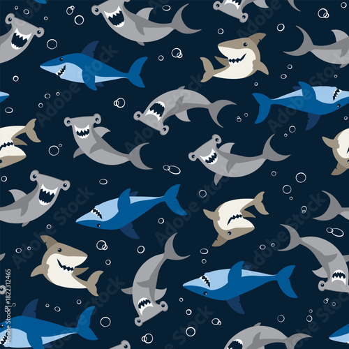 Cute, smiling shark seamless vector pattern. Repeating illustration with hammerhead and great white sharks on a navy blue background. Apparel graphic artwork.