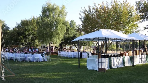 White wedding table outside with floral decorations