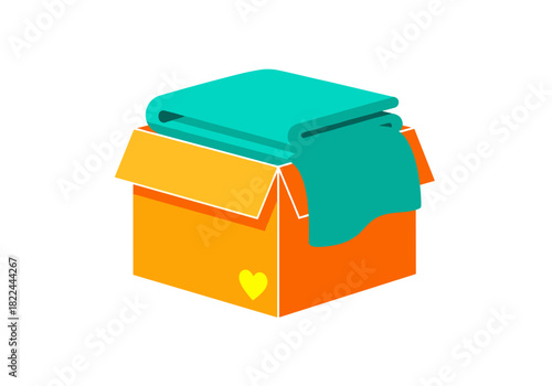 Cardboard box with folded blanket for donation in colorful design  