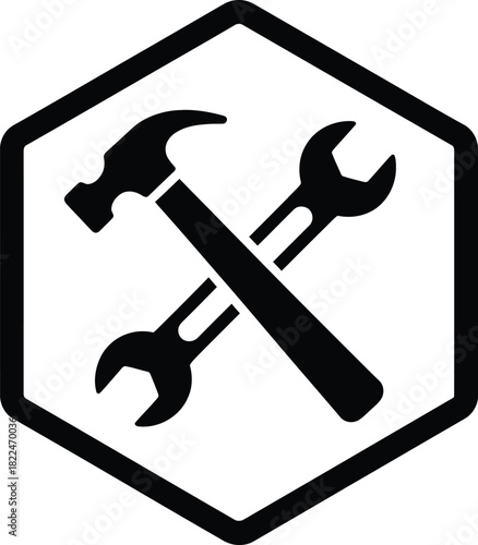 Handyman tools, crossed hammer and wrench silhouette icon