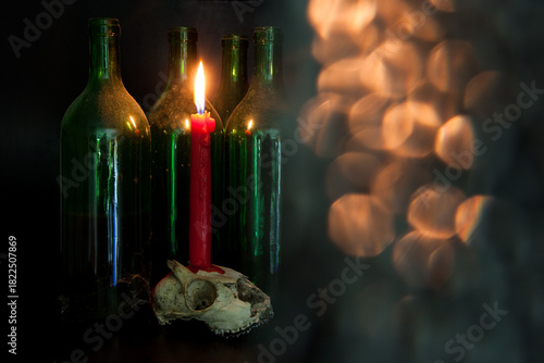 Between dusty wine bottles rests an animal skull, a red candle dripping on its surface. Flickering, mystical lights cast eerie shadows, deepening the dark and haunting atmosphere.