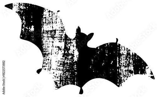 Bat flies dramatically in a spooky Halloween scene