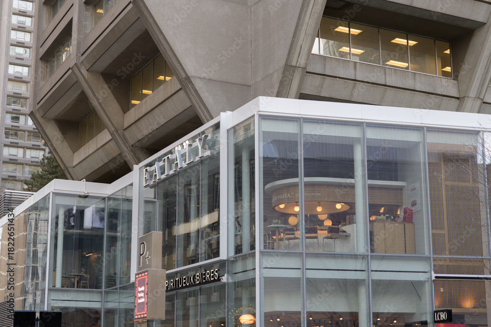 Fototapeta premium exterior building and sign of Eataly an Italian restaurant located inside Manulife Centre, located at 55 Bloor St W, Toronto