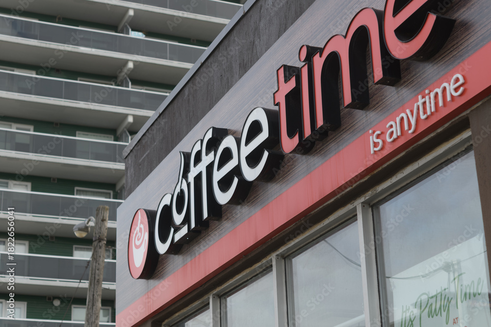Fototapeta premium exterior building facade and sign of Coffee Time located here at 1471 Eglinton Av W, Toronto