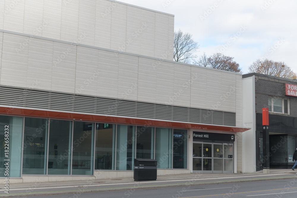Fototapeta premium exterior building facade and sign of Forest Hill LRT Station located at 842 Eglinton Av W, Toronto