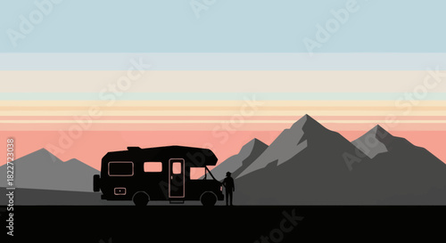 Camper van and person silhouette against a mountain landscape at sunset.