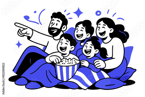 Family Movie Night. Movie night fun. Family lying on a pile of cushions with blankets and popcorn, pointing