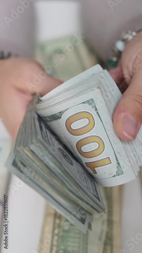 vertical screen quick finger movements sorting and counting currency, closeup of hands organizing and counting paper currency rapidly, rapid hand motions as seller prepares cash and change