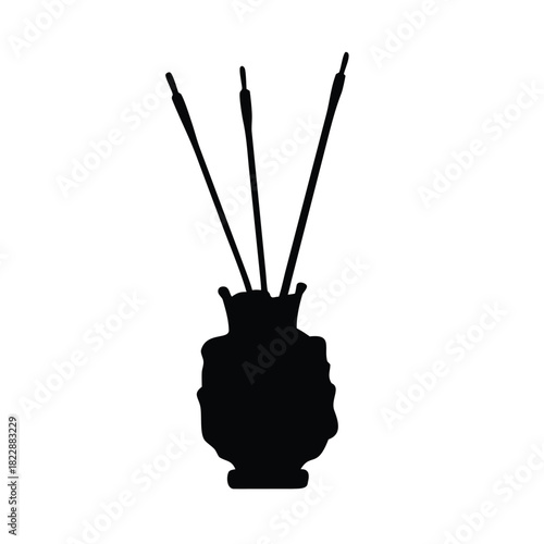A silhouette of a vase with three reed diffusers stands on a white background.