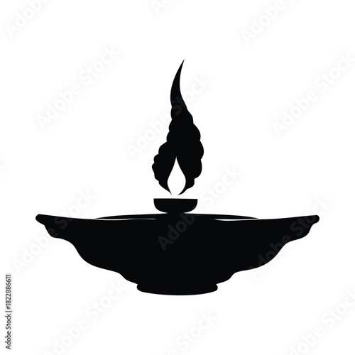 A silhouette of a diya lamp with a flame burning brightly, symbolizing light and spirituality.