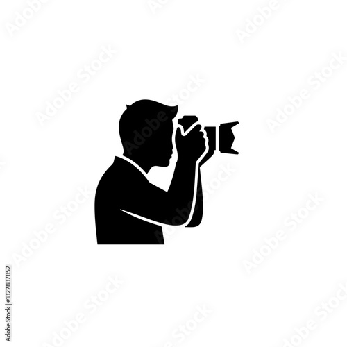 Photographer silhouette holding a camera