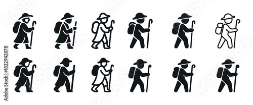 Monochrome hiker silhouettes with backpacks and walking sticks