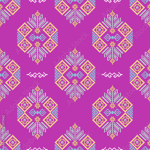 Ethnic boho ornament design on a pink background. Pixel seamless pattern. Vector illustration for web design or print. Cross-stitch design vector for textiles, wallpaper, rugs, and fabrics on print.