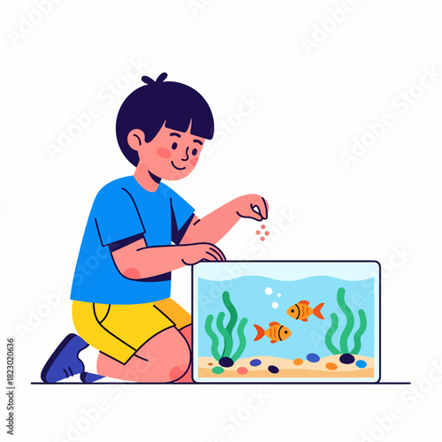 Young boy happily feeding fish in a home aquarium.