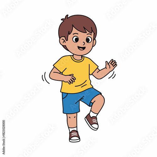 Happy young boy in yellow shirt and blue shorts is jumping.