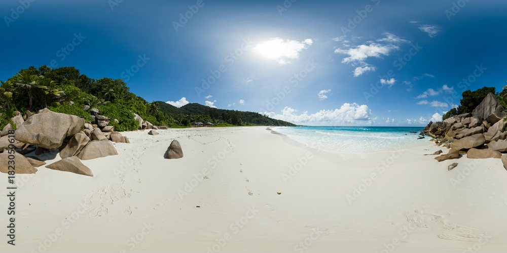 Fototapeta premium A peaceful beach featuring soft white sand, large granite boulders, and vibrant greenery under a bright sky. Petite Anse Beach, La Digue, Seychelles. Virtual Reality 360.