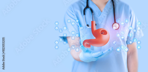 Tableau sur toile Gastroenterologist reviewing a digital image obtained via endoscopy of the stomach against a clean, light blue background